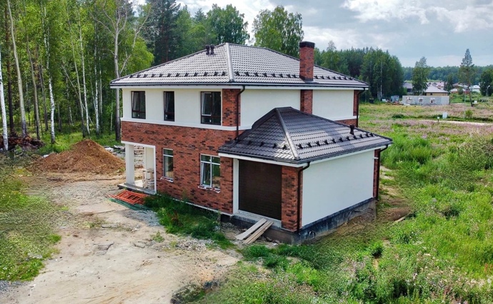 Кирпичный дом с гаражом